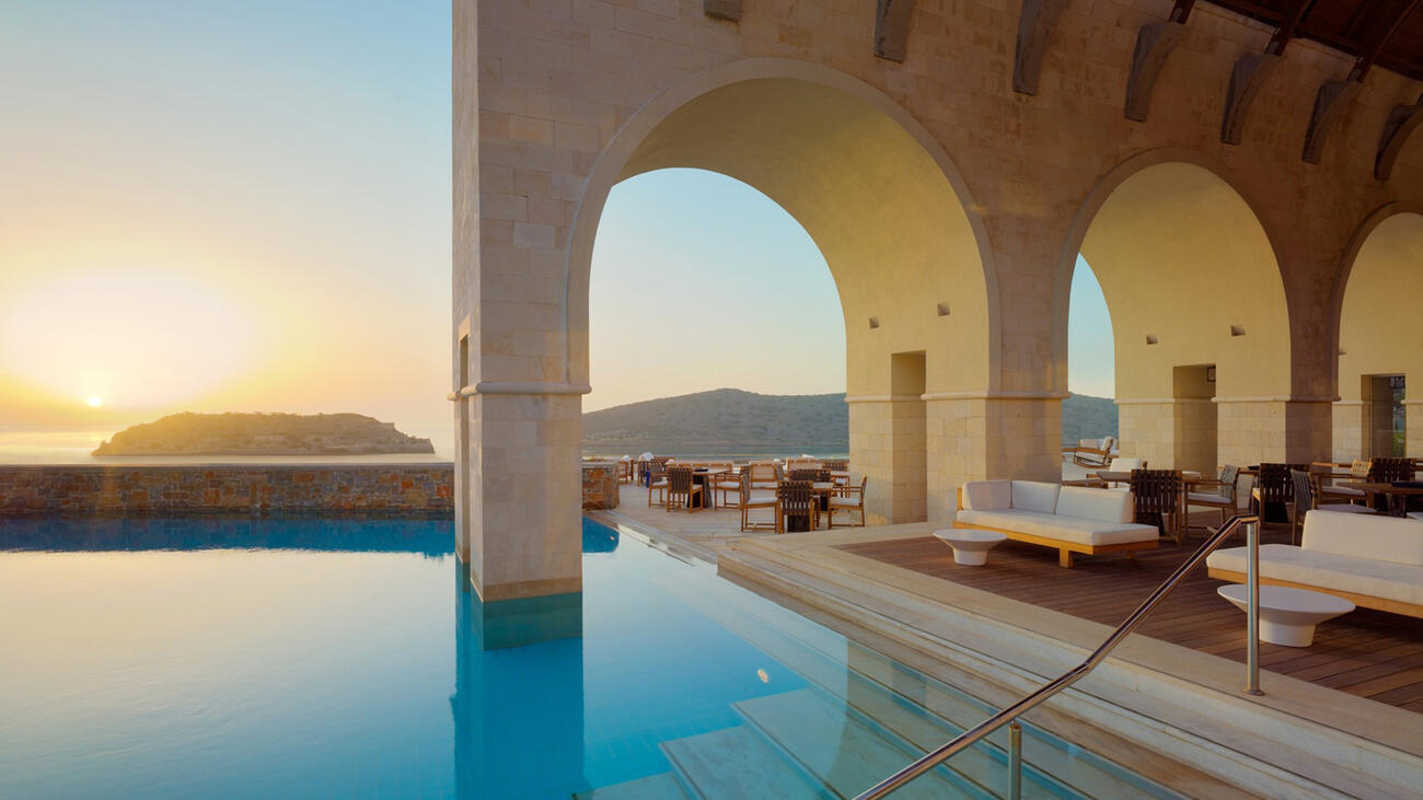 Pool Sunset Blue Palace Resort & Spa Kreta Griechenland